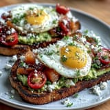 A vibrant spring brunch board with avocado toast, smoked salmon, and fresh veggies for sharing.