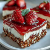 Delicious Strawberry Pretzel Salad dessert bars featuring a crunchy pretzel crust and fresh fruit.