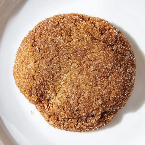 Freshly baked Soft Ginger Cookies with a crackled surface; imagine the warm, sweet aromas filling your kitchen.