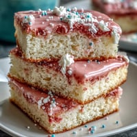 Spring Ombre Cake in pastel pink and yellow with silky buttercream frosting.