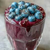 Probiotic Kefir Smoothie: creamy, vibrant blueberry swirl with flaxseed for breakfast.